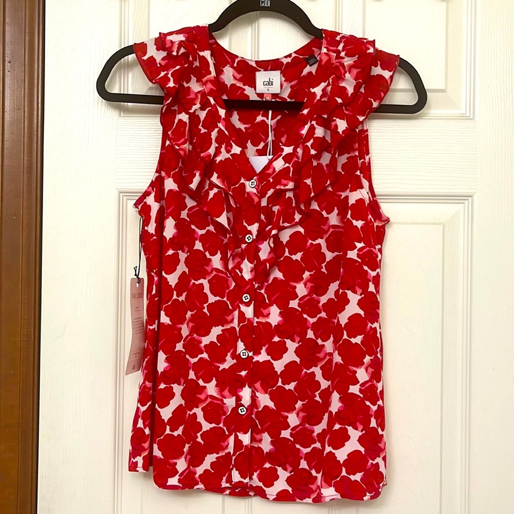 This Red and White Rosy Top is 100% Polyester.